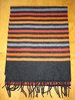 Longue écharpe rayée noir, rouille, orange et grise